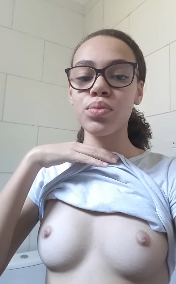 young girl showing off her breasts thumbnail